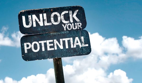 Unlock your Potential sign with clouds and sky background